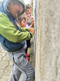 Boy wearing hat on floor