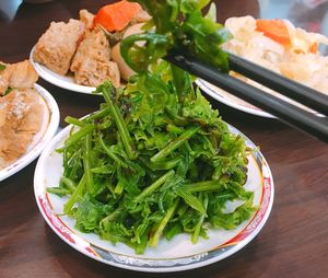 High angle view of chopped vegetables in bowl on table