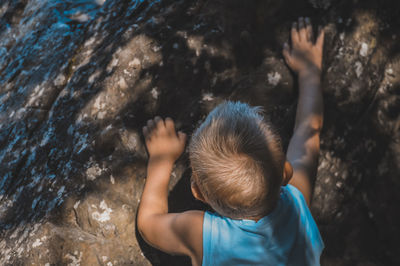 High angle view of boys on rock