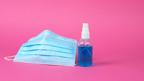 Close-up of bottle against blue background