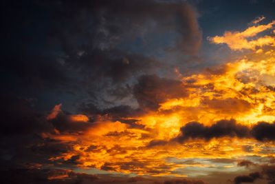 Low angle view of dramatic sky during sunset