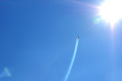 Low angle view of vapor trails in sky