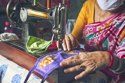 Midsection of woman working at shop