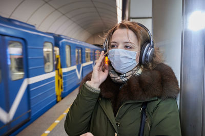 Portrait of young woman using mobile phone