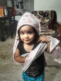 Portrait of a smiling girl at home