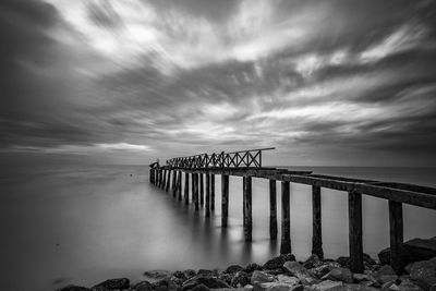 Pier on sea against sky