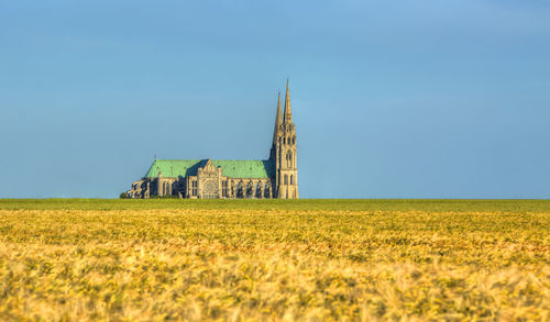 Built structure on field against clear sky