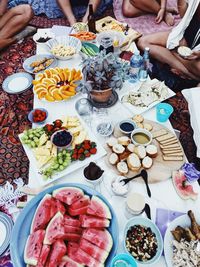 High angle view of people having food during picnic