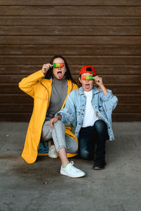 Low angle view of young man standing on street
