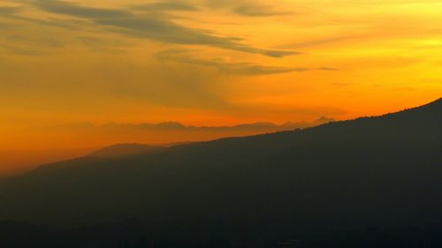 Scenic view of mountains at sunset