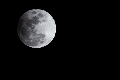 Low angle view of moon against sky at night