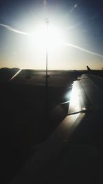 Close-up of airplane flying over runway