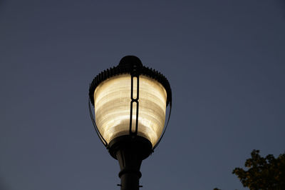 Low angle view of illuminated light against clear sky