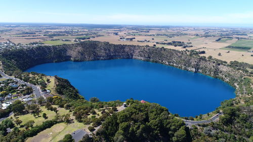 High angle view of lake and trees against sky