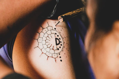 Close-up of hand holding clock