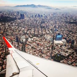 High angle view of city and buildings against sky