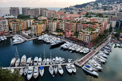 High angle view of boats moored on river in city