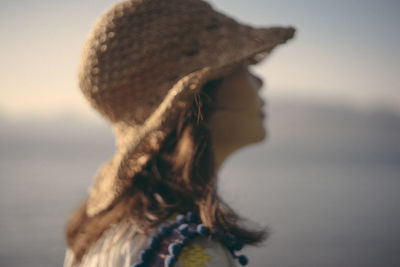 Close-up of woman by sea