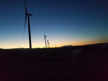 Scenic view of silhouette landscape against clear sky during sunset