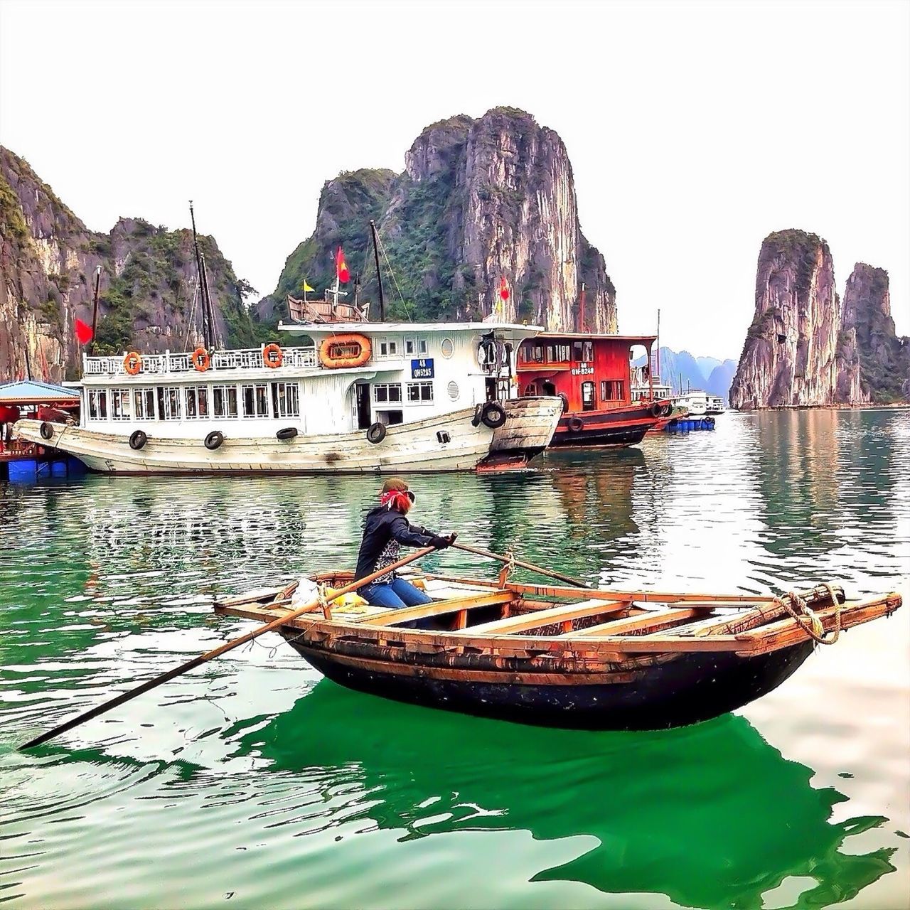 nautical vessel, water, transportation, boat, mode of transport, moored, clear sky, reflection, mountain, lake, travel, waterfront, rock - object, nature, tranquility, sky, tranquil scene, day, outdoors, beauty in nature