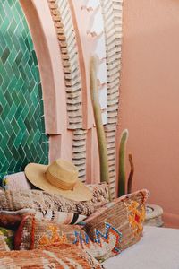 Hat and textile against wall