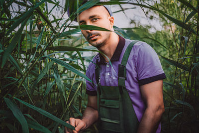 Portrait of young man standing outdoors