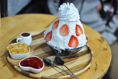 Close-up of cake with ice cream on table