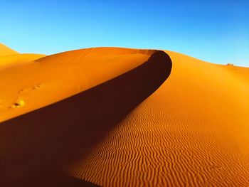 Scenic view of desert against clear sky