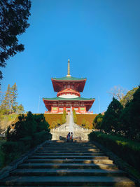 Low angle view of traditional building against blue sky