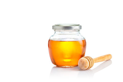 Close-up of drink in glass against white background