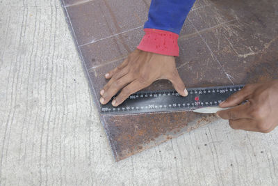 High angle view of woman working on floor