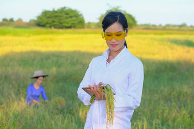 Woman standing on field