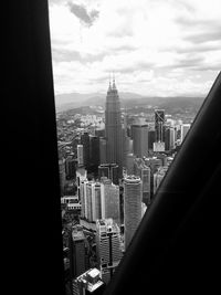 Modern buildings in city against sky