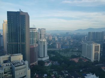 High angle view of buildings in city against sky