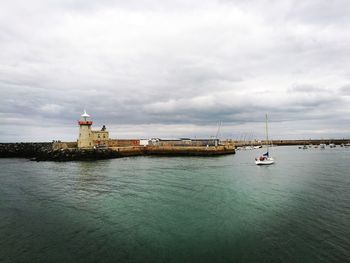 Howth harbor against sky