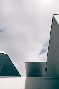 Low angle view of building against cloudy sky