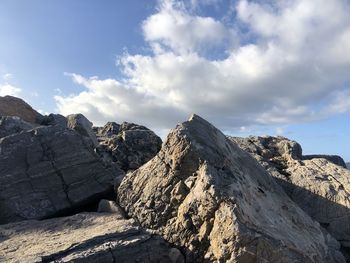 Rock formations on landscape against sky