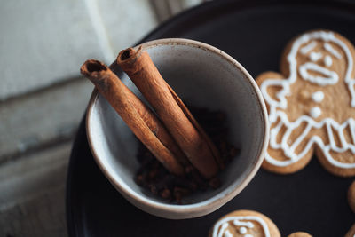 High angle view of spices and biscuits on plate