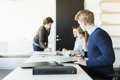 Professor teaching students in classroom