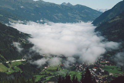 Scenic view of mountains covered with clouds