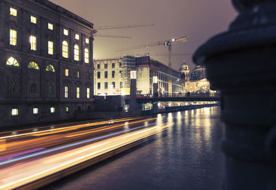 Light trails on illuminated city at night