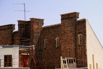 Low angle view of built structure against clear sky