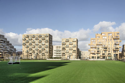 Apartment buildings overlooking a football field in amsterdam