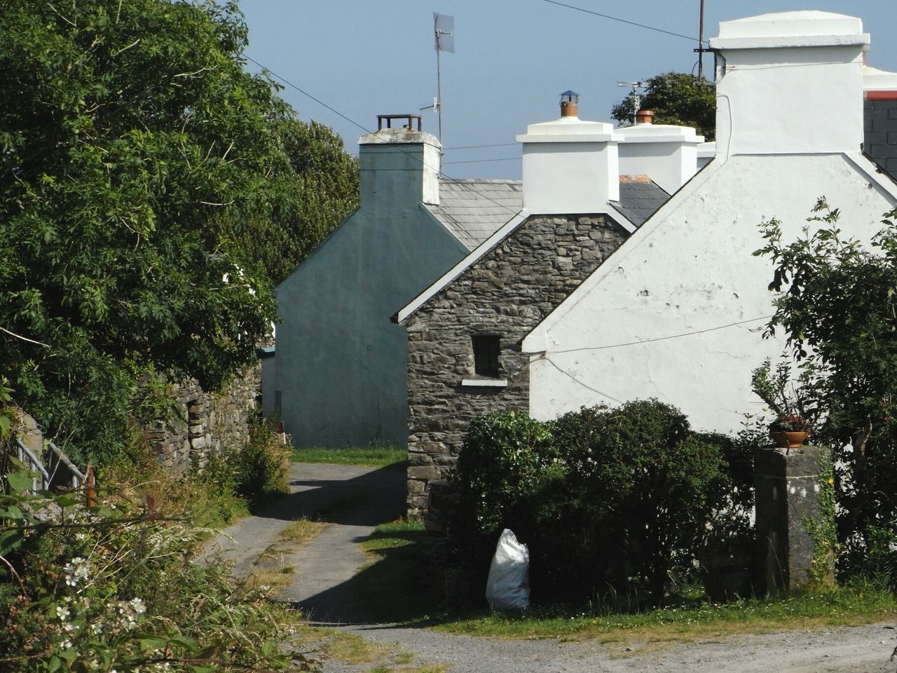 Old houses slate roofs grouped together country road Sheep's Head wildatlanticway Ireland