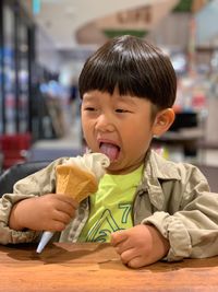 Cute boy eating ice cream