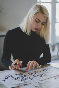 Young woman practicing calligraphy