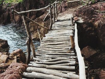 View of wooden footbridge in forest