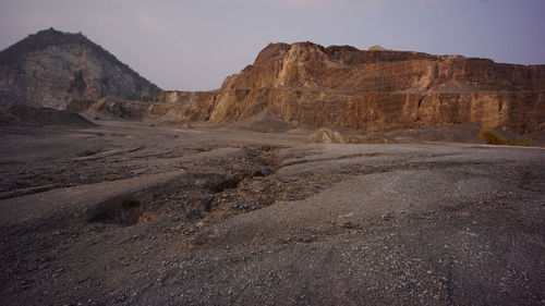 Rock formations in desert against sky