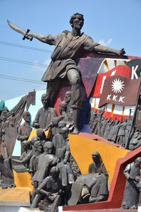 Low angle view of statue against sky