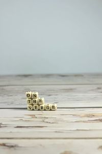Close-up of stack on table against sea
